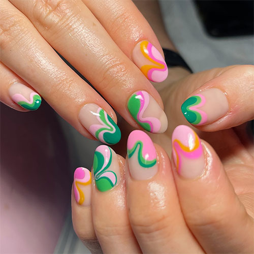 Vibrant colored abstract swirl nails are one of the perfect manicure designs for spring
