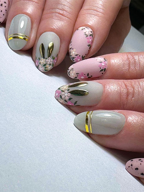 Easter nails with floral accent nails, bunny, and gold stripes nail art designs