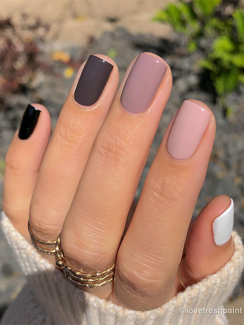 Long lasting different shades of brown nails short with a white accent nail