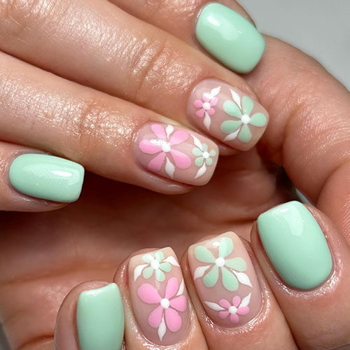 Short mint green nails with two accent nude nails adorned with pink and mint green flowers with white leaves