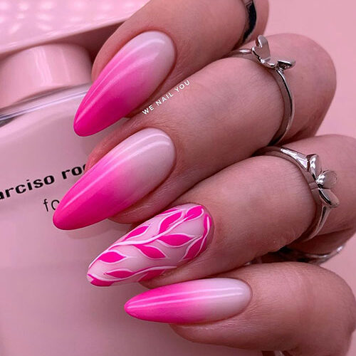 hot pink ombre nails almond with a nude accent adorned with hot pink leaf nail art is one of the best pink ombre nail designs