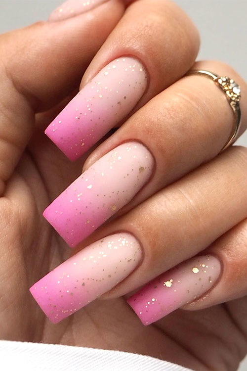 Long square-shaped matte hot pink ombre nails with gold glitter is one of the best pink ombre nail designs in 2024