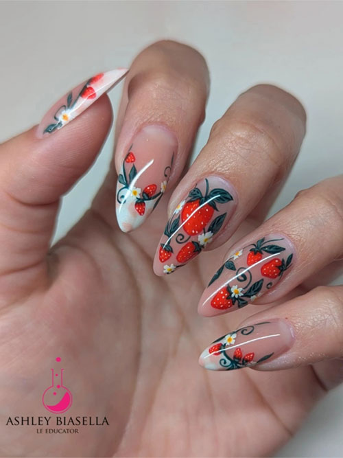 Nude nails with red strawberries, green leaves, and white flowers, finished with crisp white French tips for a playful look. Nude nails with red strawberries, green leaves, and white flowers, finished with crisp white French tips for a playful look.