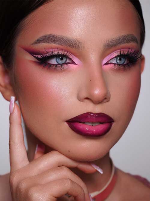 Bold makeup look featuring pink and berry tones, dramatic double-winged eyeliner, and glossy ombré berry lips for high glam. Bold makeup look featuring pink and berry tones, dramatic double-winged eyeliner, and glossy ombré berry lips for high glam.