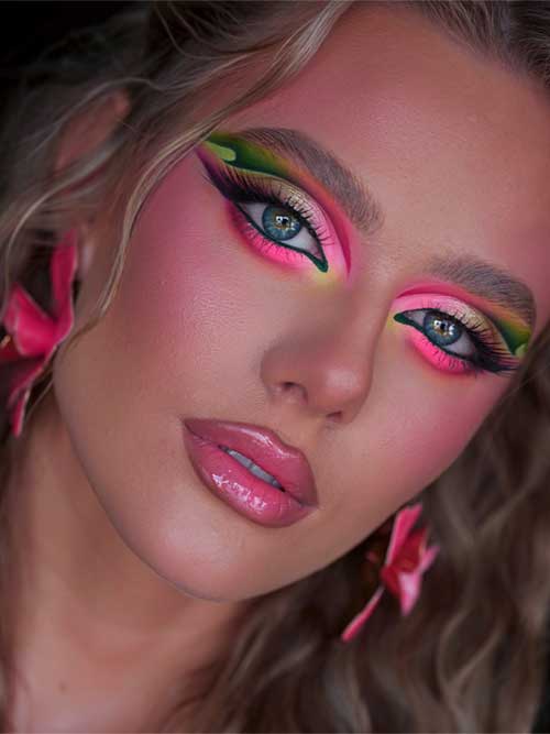 Bold tropical sunset makeup with neon eyeshadow, flushed cheeks, and glossy lips, perfect for creative photoshoots or festivals.Credit: Instagram@ Bold tropical sunset makeup with neon eyeshadow, flushed cheeks, and glossy lips, perfect for creative photoshoots or festivals.