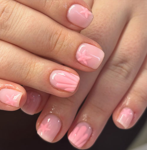 Charming pink seashell nails with 3D starfish designs, perfect for beach days and adding a whimsical touch to your style. Charming pink seashell nails with 3D starfish designs, perfect for beach days and adding a whimsical touch to your style.