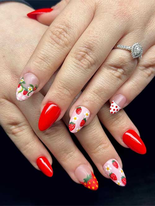 Cheerful strawberry nails in red and pink, with playful designs and a sparkling diamond ring, showcasing an elegant almond shape. Cheerful strawberry nails in red and pink, with playful designs and a sparkling diamond ring, showcasing an elegant almond shape.