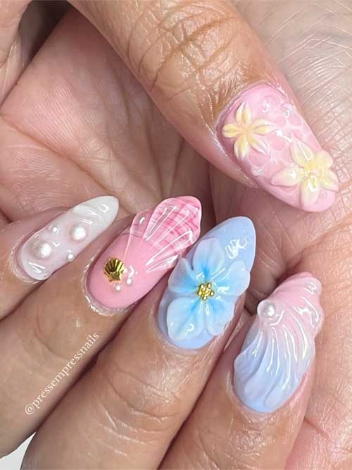 Dreamy seashell nails featuring pearl details on a pastel pink and blue background, perfect for a beachy summer look. Dreamy seashell nails featuring pearl details on a pastel pink and blue background, perfect for a beachy summer look.