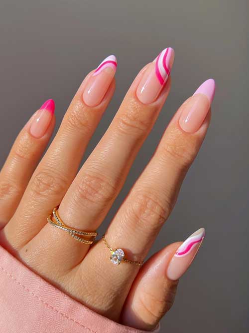 Elegant nude nails with pink and white swirls, featuring a whimsical solid pink tip for a chic, modern French manicure. Elegant nude nails with pink and white swirls, featuring a whimsical solid pink tip for a chic, modern French manicure.