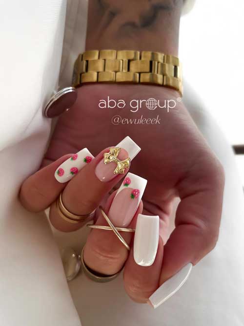 Elegant white nails adorned with tiny red strawberries, green leaves, and a gold bow, creating a fresh and fruity look. Elegant white nails adorned with tiny red strawberries, green leaves, and a gold bow, creating a fresh and fruity look.