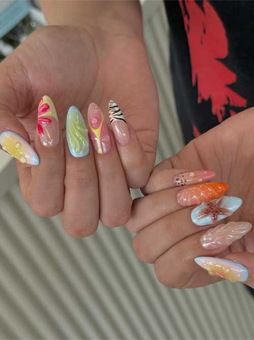 Intricate ocean-themed nails with seashells and starfish, combining vibrant colors and textures for a stylish summer look. Intricate ocean-themed nails with seashells and starfish, combining vibrant colors and textures for a stylish summer look.
