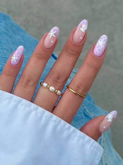 Lavender seashell nails with delicate starfish and pearl accents, ideal for a stylish summer beach-inspired manicure. Lavender seashell nails with delicate starfish and pearl accents, ideal for a stylish summer beach-inspired manicure.