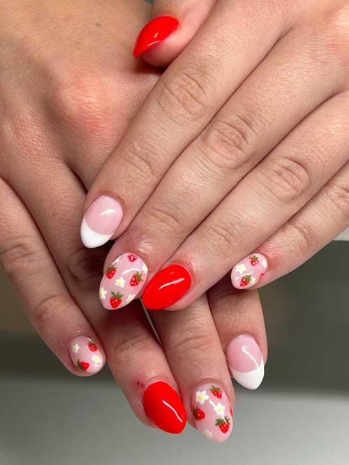 Strawberry nail design on nude pink base, featuring red strawberries, green leaves, white flowers, and a white French tip accent. Strawberry nail design on nude pink base, featuring red strawberries, green leaves, white flowers, and a white French tip accent.