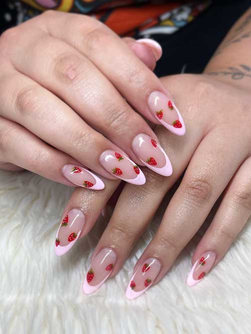 Strawberry nail design with pink French tips, featuring a nude base, tiny red strawberries, green leaves, and a glossy finish. Strawberry nail design with pink French tips, featuring a nude base, tiny red strawberries, green leaves, and a glossy finish.