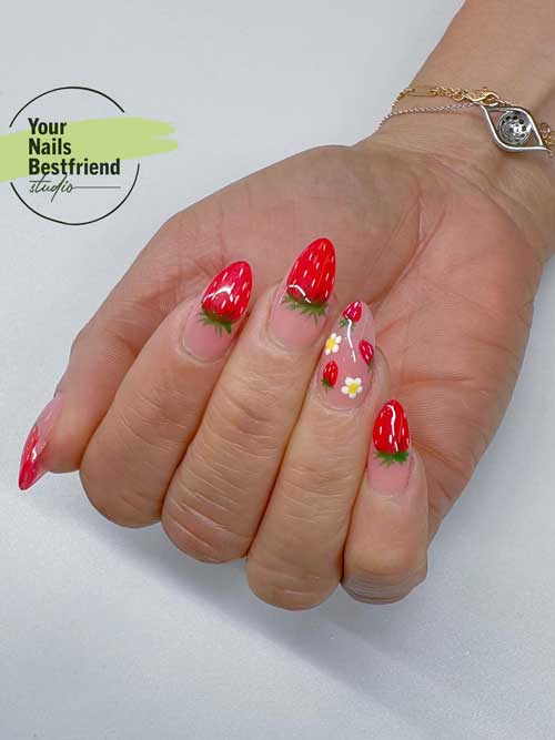 Strawberry nail tips with a glossy nude pink base, red tips, tiny strawberry details, and a chic gold wavy ring. Strawberry nail tips with a glossy nude pink base, red tips, tiny strawberry details, and a chic gold wavy ring.