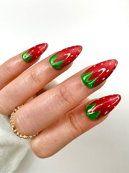 Strawberry nails feature red and green hues with white seed patterns and green leaf accents for a playful, fruity look. Strawberry nails feature red and green hues with white seed patterns and green leaf accents for a playful, fruity look.