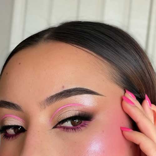 Stylish makeup featuring neutral tones, smoky effects, and a pop of pink liner, showcasing a fresh, dewy look and bold blush. Stylish makeup featuring neutral tones, smoky effects, and a pop of pink liner, showcasing a fresh, dewy look and bold blush.