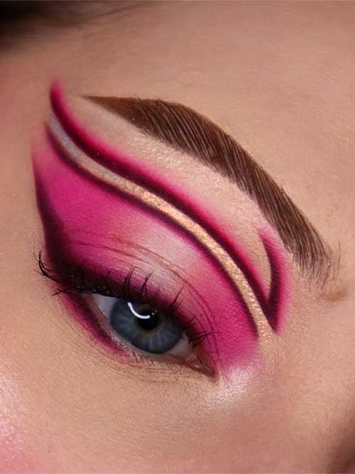 Unique pink and gold eyeshadow look with artistic lines, perfect for expressing creativity at special occasions or photoshoots. Unique pink and gold eyeshadow look with artistic lines, perfect for expressing creativity at special occasions or photoshoots.