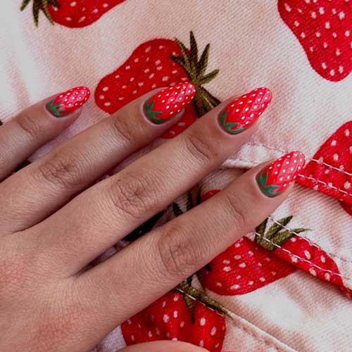 Vibrant red strawberry nail design with green and white accents, featuring playful patterns and abstract shapes for a fun look. Vibrant red strawberry nail design with green and white accents, featuring playful patterns and abstract shapes for a fun look.