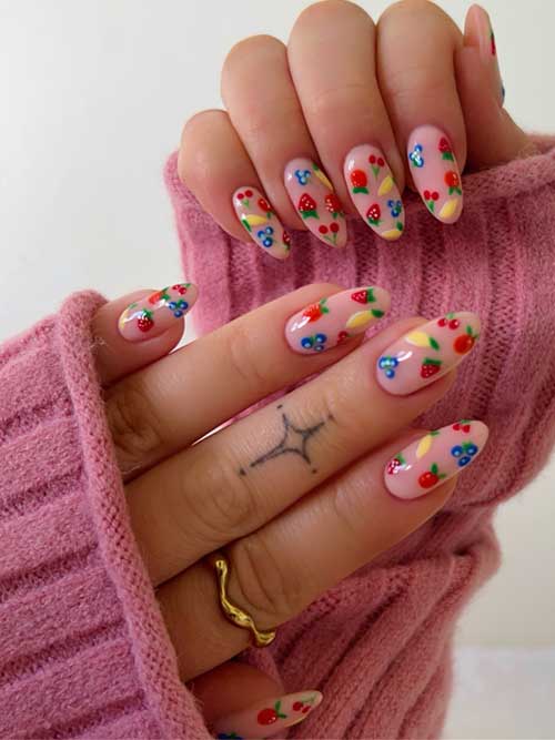 Vibrant summer nails with a soft pink base, featuring playful fruit designs like strawberries, cherries, and bananas. Vibrant summer nails with a soft pink base, featuring playful fruit designs like strawberries, cherries, and bananas.