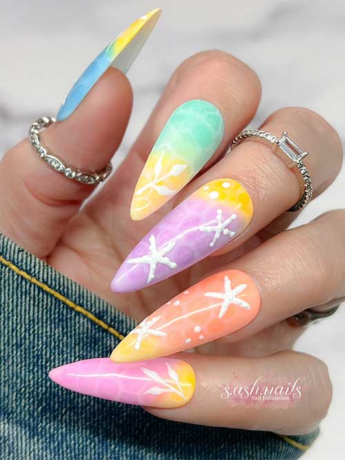 Almond Multicolor nails showcase a dreamy gradient of pastels with marine patterns, capturing the essence of summer at the beach. Almond Multicolor nails showcase a dreamy gradient of pastels with marine patterns, capturing the essence of summer at the beach.