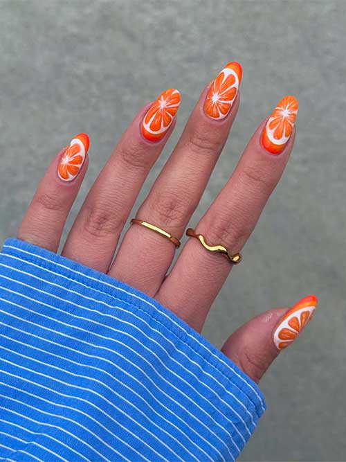 Bright orange slice nails with delicate white details, evoking a sunny tropical feel and the freshness of citrus fruit. Bright orange slice nails with delicate white details, evoking a sunny tropical feel and the freshness of citrus fruit.