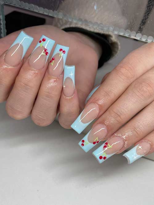 Cute Fruit nails French tip featuring soft pink with baby blue French tips, adorned with red cherries and green stems. Cute Fruit nails French tip featuring soft pink with baby blue French tips, adorned with red cherries and green stems.
