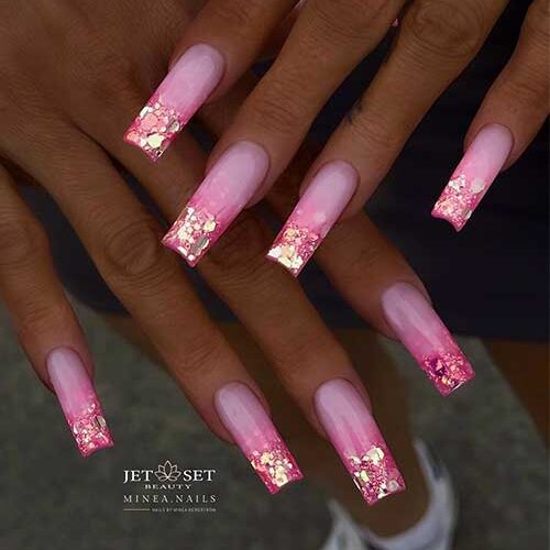 Dazzling pink ombre nails with a smooth gradient and chunky gold glitter tips are perfect pink ombre nail ideas.