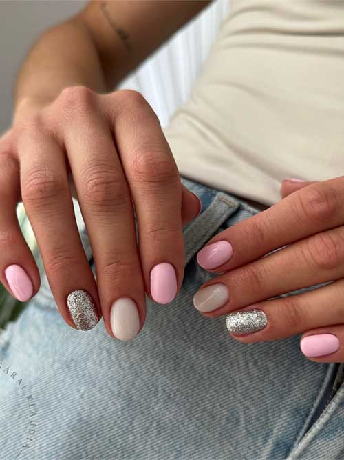 Elegant light pink nails featuring dazzling silver glitter and creamy white details, perfect for adding subtle luxury to your style. Elegant light pink nails featuring dazzling silver glitter and creamy white details, perfect for adding subtle luxury to your style.