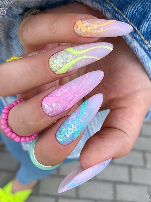 Enchanting multicolor nails with pastel shades and glitter on a lavender base, showcasing a whimsical and creative style. Enchanting multicolor nails with pastel shades and glitter on a lavender base, showcasing a whimsical and creative style.