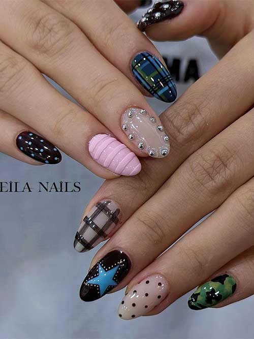 Funky almond-shaped nails feature glossy plaid, polka dots, camouflage, a blue star, and a cozy pink cable-knit texture.