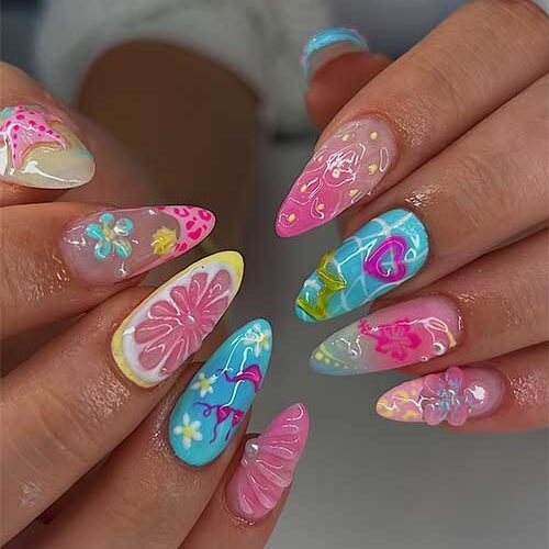 Funky nails featuring pink starfish, citrus slices, hearts, and sunflowers, perfect for summer days and beach parties.