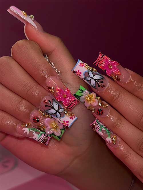 Funky nails with 3D flowers, ladybugs, and butterflies in bright colors and patterns create a dramatic, whimsical summer look.