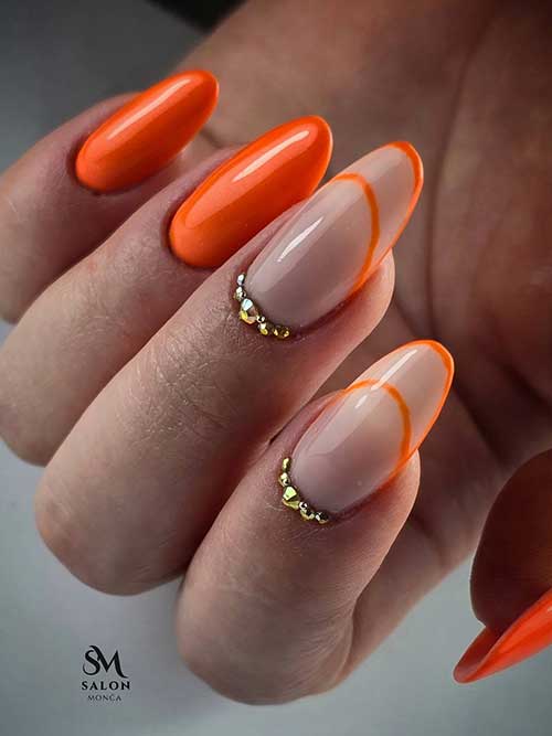 Glossy orange nails with negative space accents and gold rhinestones, blending bold color with chic elegance for any occasion. Glossy orange nails with negative space accents and gold rhinestones, blending bold color with chic elegance for any occasion.