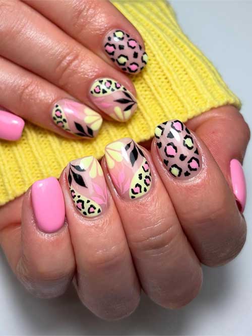Playful short pink nails with fierce animal prints and soft floral designs, blending daring elegance and confident femininity. Playful short pink nails with fierce animal prints and soft floral designs, blending daring elegance and confident femininity.