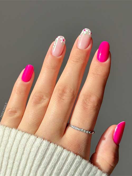 Short pink and nude nails with delicate white flowers near the cuticles, blending elegance and playful charm for spring. Short pink and nude nails with delicate white flowers near the cuticles, blending elegance and playful charm for spring.