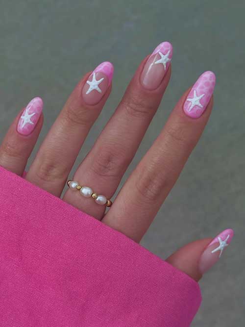 Short pink nails adorned with whimsical white stars, combining playful charm and femininity for a delightful look. Short pink nails adorned with whimsical white stars, combining playful charm and femininity for a delightful look.