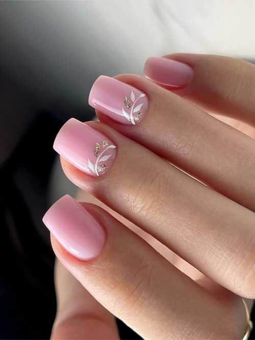 Short pink nails with white floral designs and gold glitter accents, radiating elegance and delicate beauty. Short pink nails with white floral designs and gold glitter accents, radiating elegance and delicate beauty.