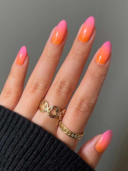 Stunning ombre nails transition from fiery orange to soft pink, resembling a warm sunset with a glossy, glamorous finish. Stunning ombre nails transition from fiery orange to soft pink, resembling a warm sunset with a glossy, glamorous finish.
