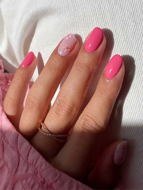 Vibrant hot pink and nude short nails, showcasing delicate floral designs that embody spring's energy and sophistication. Vibrant hot pink and nude short nails, showcasing delicate floral designs that embody spring's energy and sophistication.