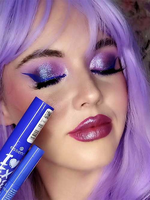 A captivating purple eyeshadow look featuring shimmering lavender and deep violet, paired with bold blue eyeliner and glossy berry lips. A captivating purple eyeshadow look featuring shimmering lavender and deep violet, paired with bold blue eyeliner and glossy berry lips.