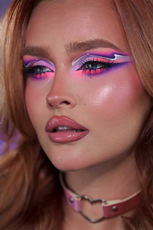 Bold purple eyeshadow with hot pink and violet creates a graphic wing, which is one of the perfect purple eyeshadow looks. Bold purple eyeshadow with hot pink and violet creates a graphic wing, which is one of the perfect purple eyeshadow looks.