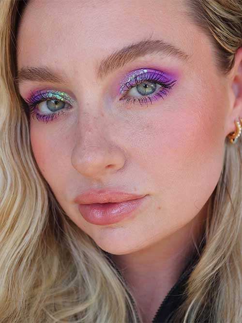 Bold purple eyeshadow with iridescent shimmers, creating a cosmic look, is one of the perfect purple eyeshadow looks. Bold purple eyeshadow with iridescent shimmers, creating a cosmic look, is one of the perfect purple eyeshadow looks.