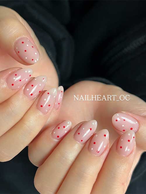 Charming milky pink nails with playful red and white polka dots, shaped in a classy almond style, perfect for any occasion. Charming milky pink nails with playful red and white polka dots, shaped in a classy almond style, perfect for any occasion.
