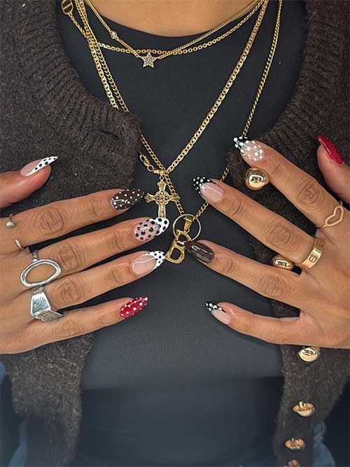 Colorful polka dot nails featuring brown dots on red and French tips with dots, showcasing a creative mix of patterns. Colorful polka dot nails featuring brown dots on red and French tips with dots, showcasing a creative mix of patterns.