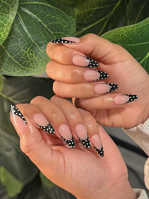 Elegant French polka dot nails with a nude base, black tips, and white dots, perfect for any occasion. Elegant French polka dot nails with a nude base, black tips, and white dots, perfect for any occasion.