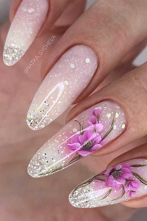 Enchanting nude almond nails with sparkling tips and floral designs, bringing a dreamy spring vibe to any occasion. Enchanting nude almond nails with sparkling tips and floral designs, bringing a dreamy spring vibe to any occasion.