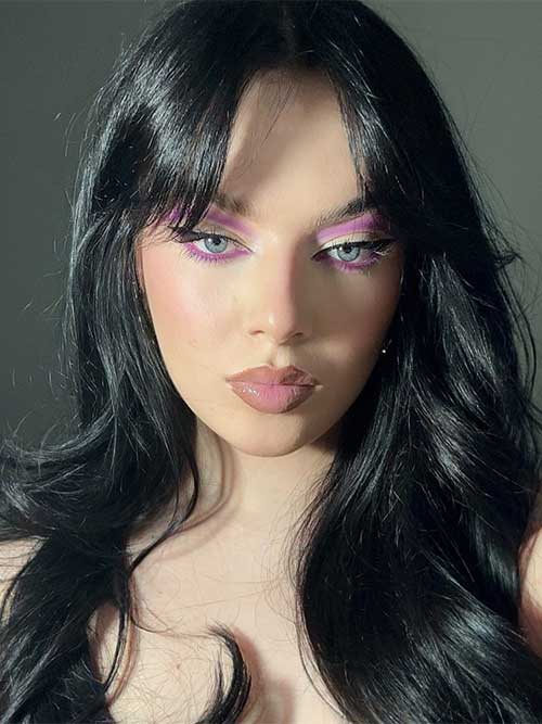 Ethereal purple eyeshadow with lavender and violet shades, classic winged liner, and glossy nude lips for a romantic look. Ethereal purple eyeshadow with lavender and violet shades, classic winged liner, and glossy nude lips for a romantic look.
