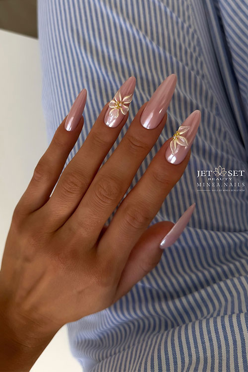 Nude almond nails with a chrome effect and delicate white flower embellishments, perfect for elegant occasions and everyday wear. Nude almond nails with a chrome effect and delicate white flower embellishments, perfect for elegant occasions and everyday wear.