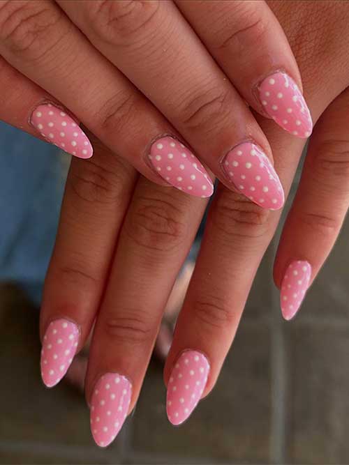 Retro-inspired pastel pink nails adorned with tiny white dots, perfect for adding a sweet touch to your sunny day look. Retro-inspired pastel pink nails adorned with tiny white dots, perfect for adding a sweet touch to your sunny day look.